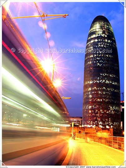 Torre Agbar with tram passing